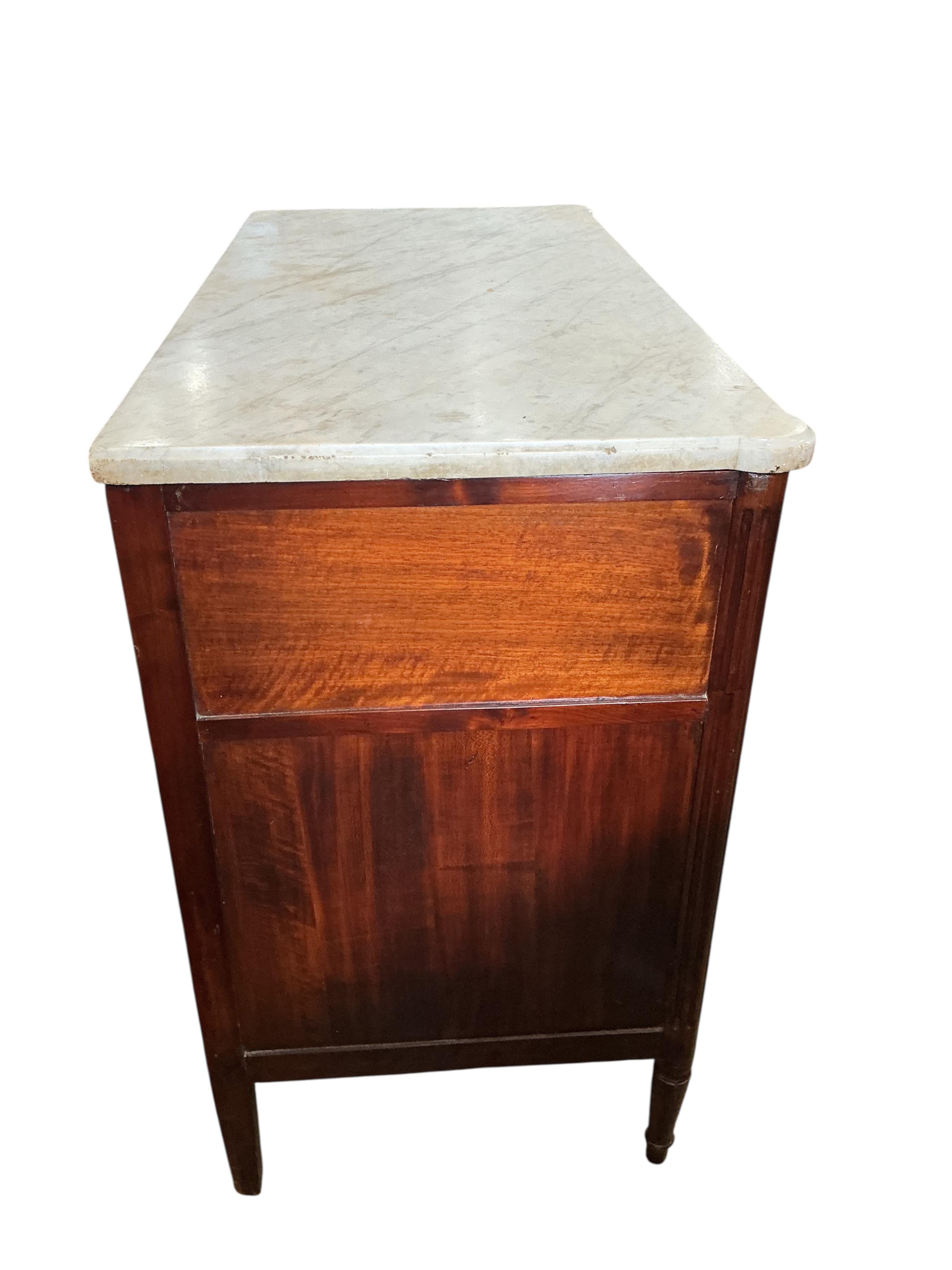 A Louis XVI style marble top mahogany commode, width 112cm, depth 55cm, height 91cm